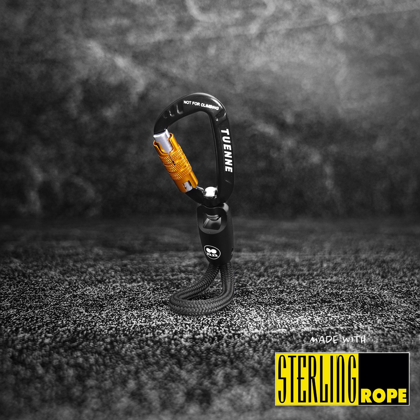 Close-up of black Tuenne rope keychain with auto-locking carabiner