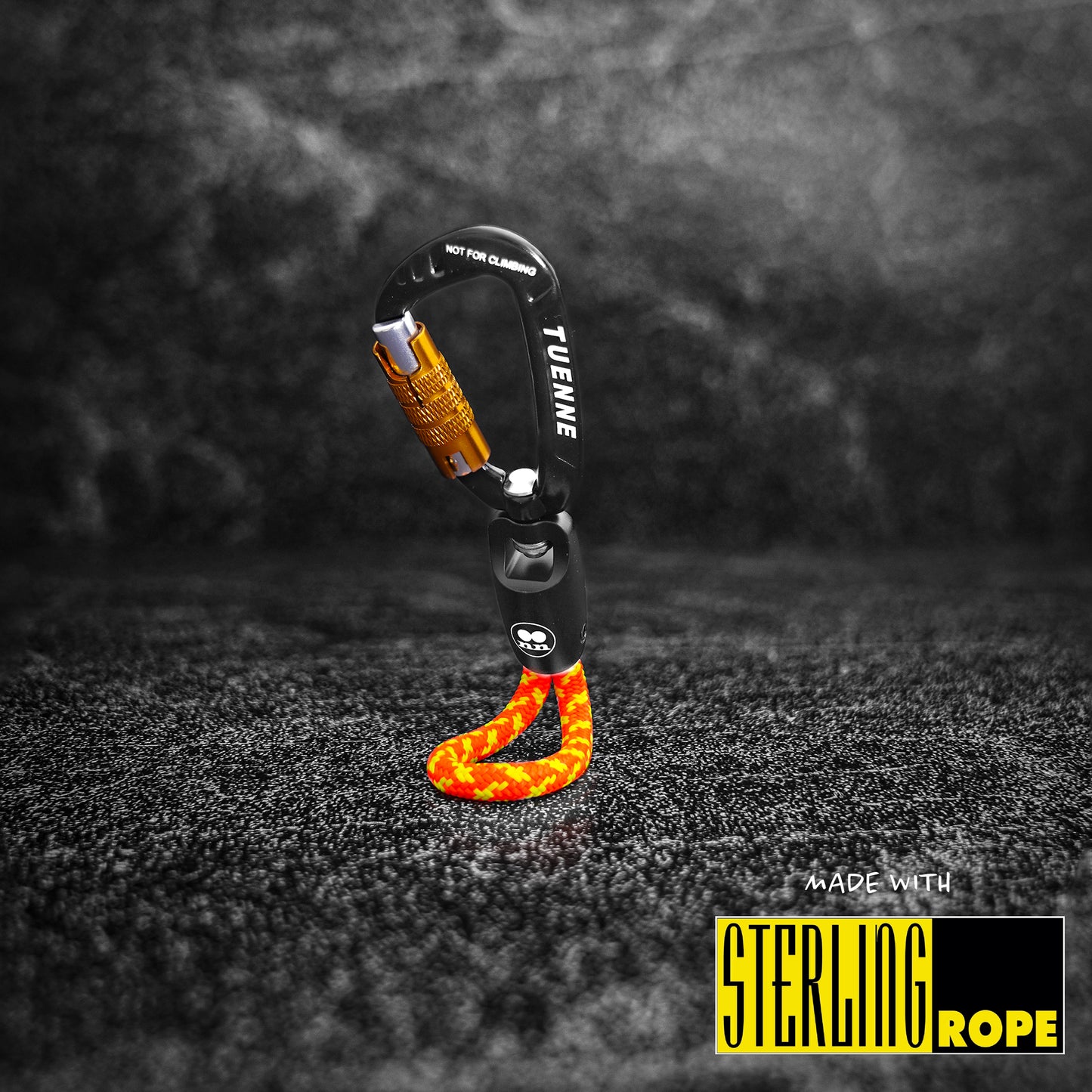 Close-up of orange Tuenne rope keychain with auto-locking carabiner