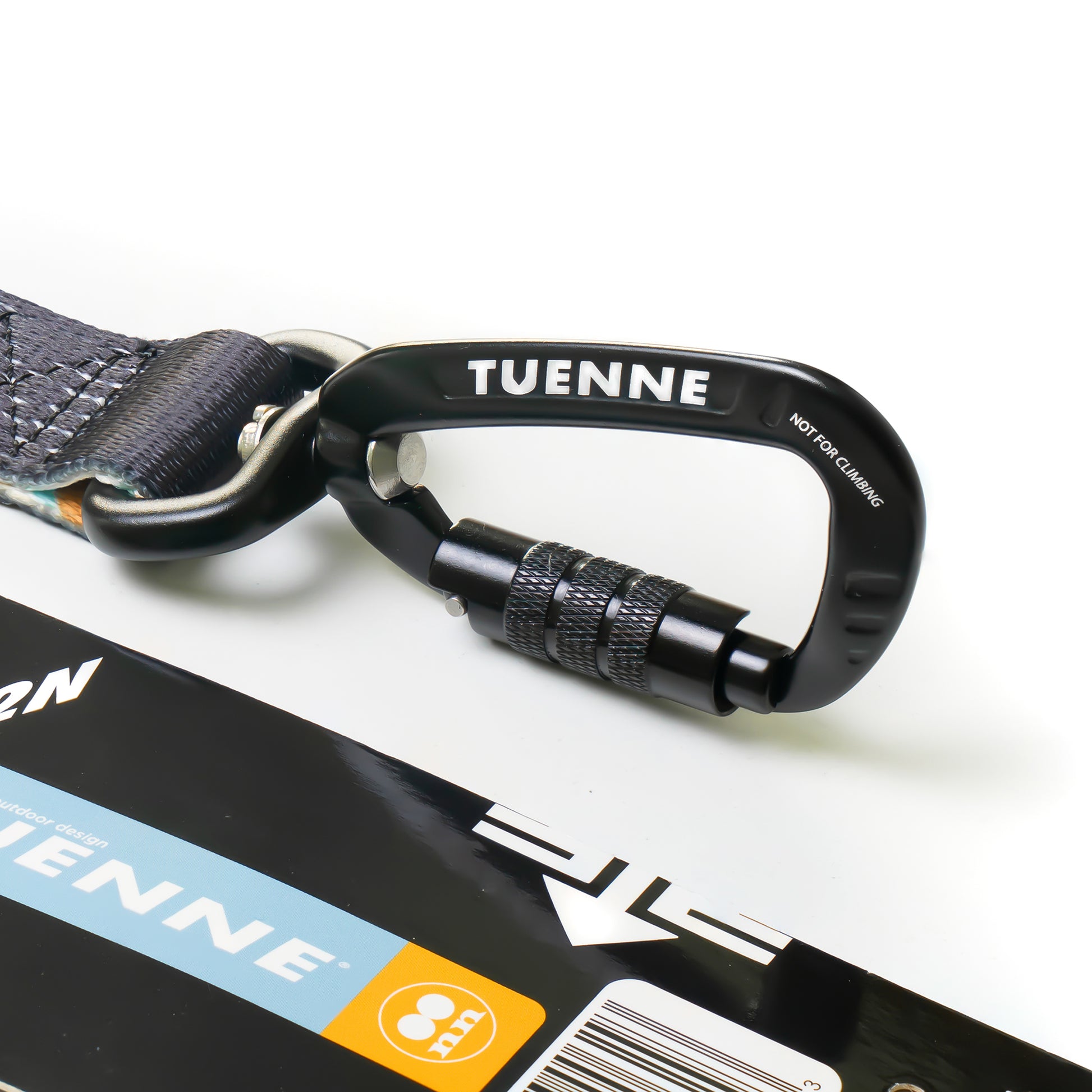 Close-up of Tuenne Southwest collar carabiner with Duraflex side-release buckle and tag holder