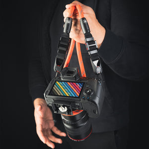 Close-up of modular climbing rope detail on Tuenne camera strap orange