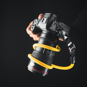 Close-up of modular climbing rope detail on Tuenne camera strap yellow