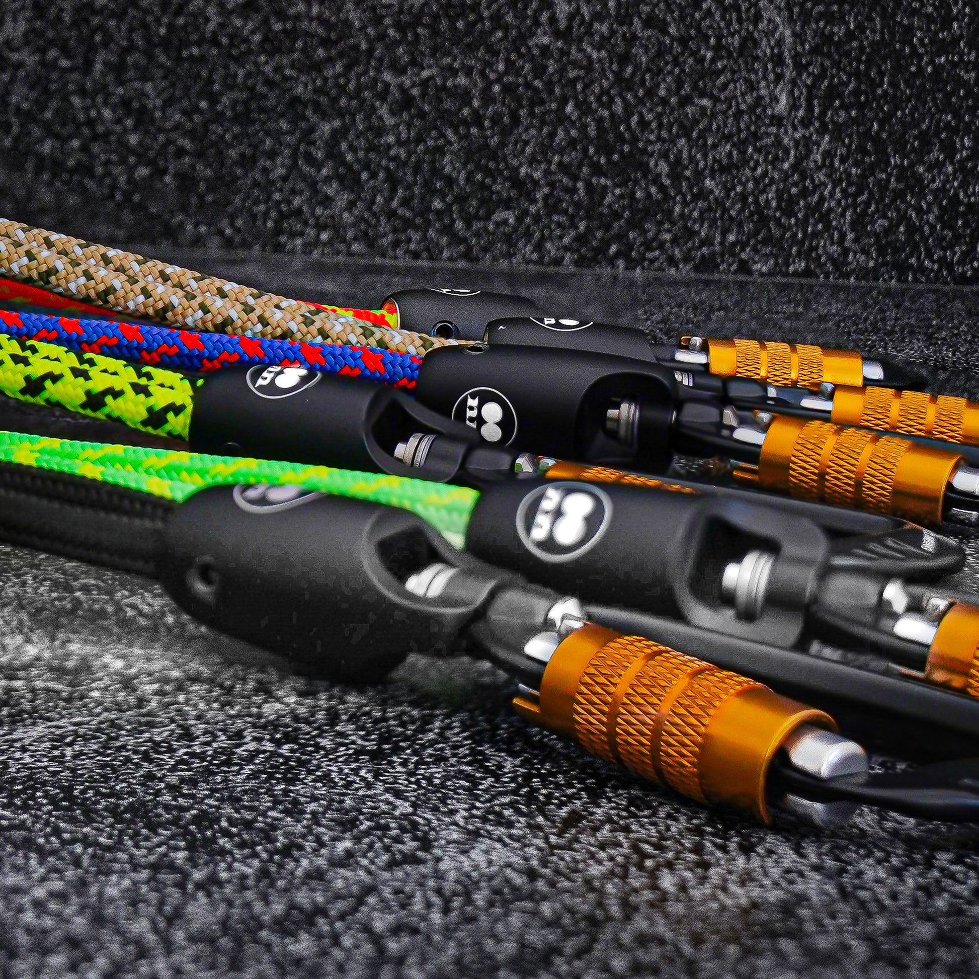 Close-up view of Tuenne rope lanyards showing auto-locking carabiner and modular components