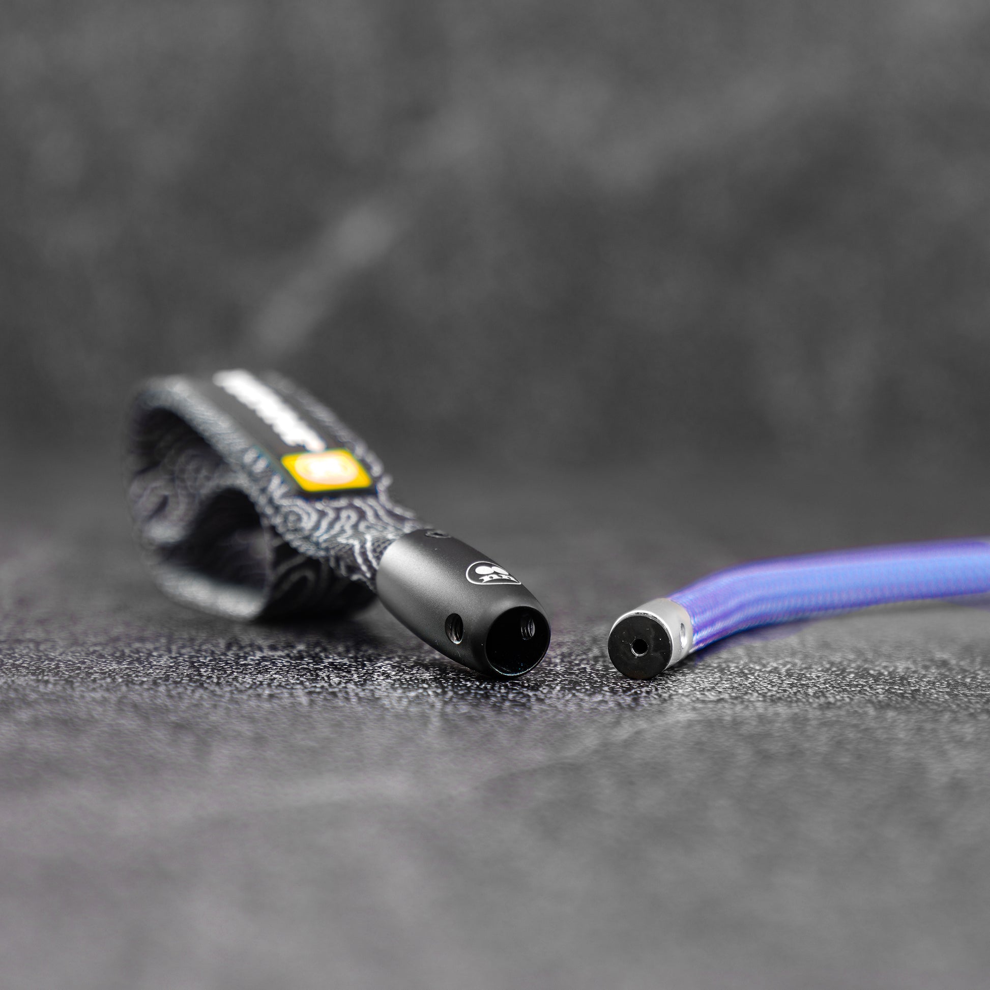 lavender color climbing rope dog leash on a slate background disassembeld in pieces.