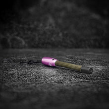 Close-up view of the Yellowstone Rope Keychain showing steel and rope details pink aluminum