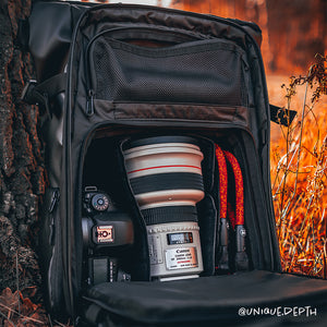 Black climbing rope camera strap compatible with Peak Design by Tuenne in camera bag orange