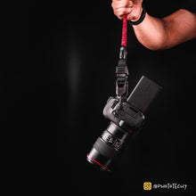 Close-up of modular climbing rope detail on Tuenne camera strap red