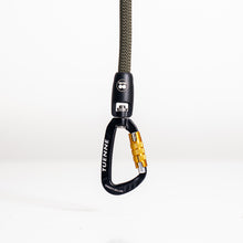 Auto-locking carabiner close-up on climbing rope leash