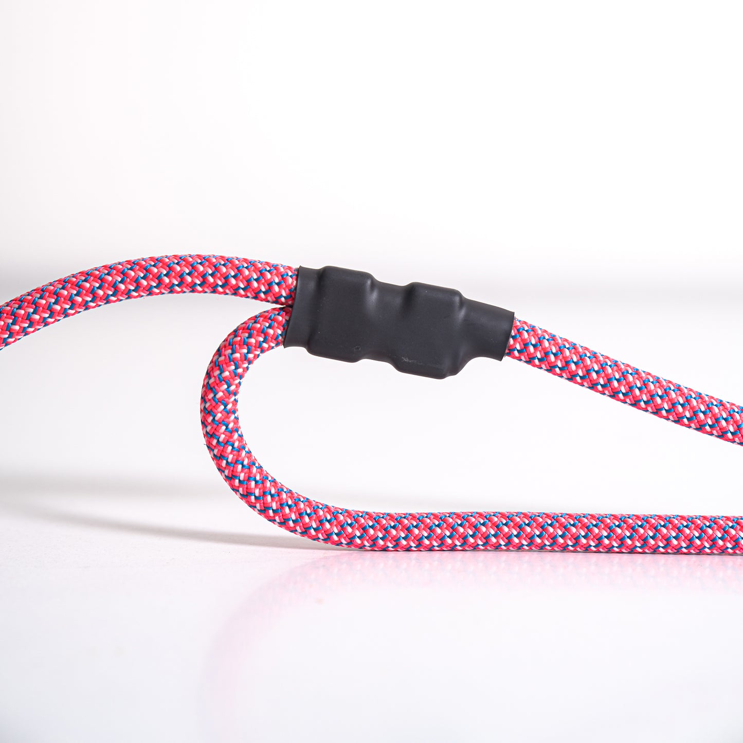 Close-up of traffic handle on pink Tuenne leash
